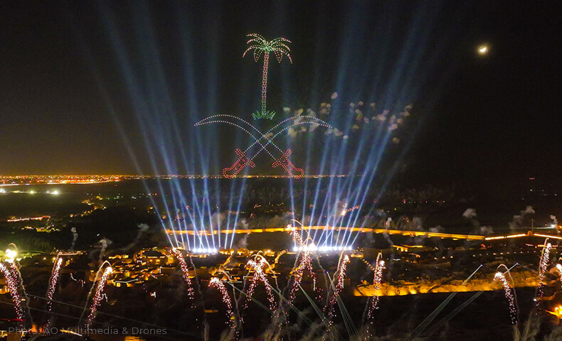 Searchlights shine up and the 3D KSA palm emblem thrones above the VIP banquet